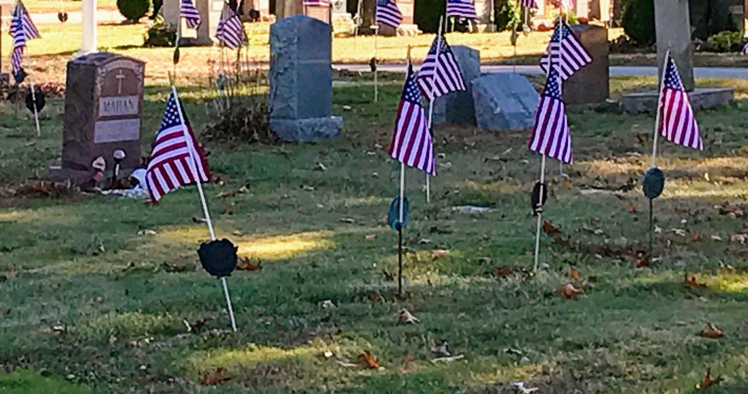 American flags wave in a Hingham cemetery as a sign of respect for those who have fought for our country.