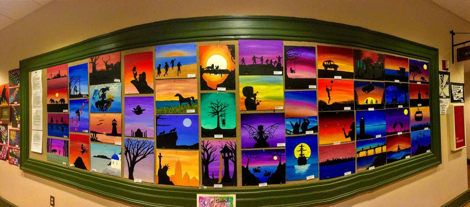 Paintings by artists from Hingham Middle School are showcased on a bulletin board on the first floor.