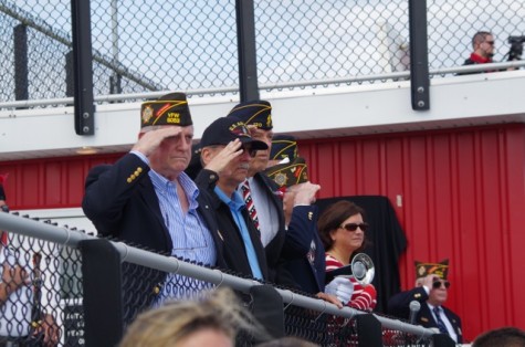 Veterans solute during the POW ceremony. 