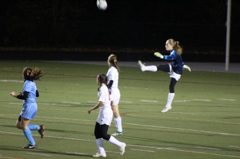After a great save, goalie Amy Kirk kicks the ball back into play