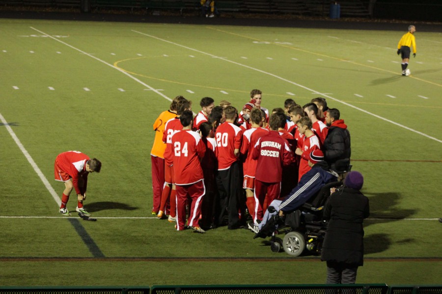 The boys huddle up before their game.
