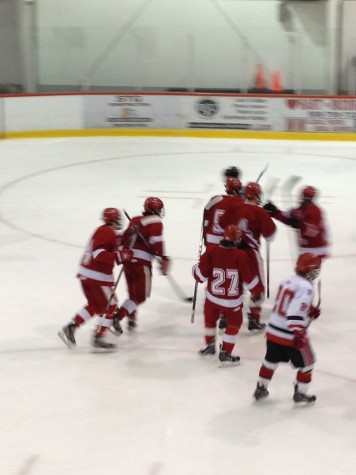 Players celebrate after a goal from Jack Hennessey.