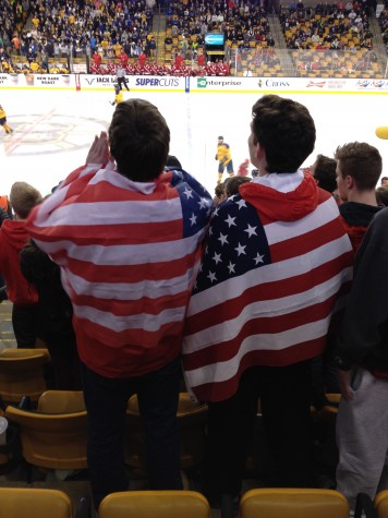 Two fans cheering, showing their patriot spirit. 