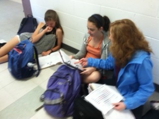 Angela White, Rose McDonald, and Renee Noordzij begin to tackle the piles of homework assigned to them. 