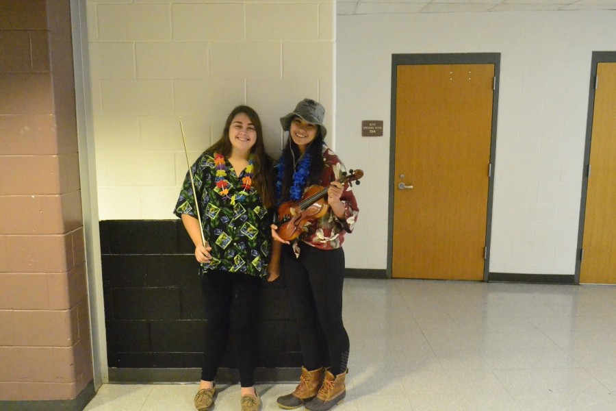 From left: Orchestra members Annie O’Donnell and Maddie Chan celebrating Hawaiian Day!