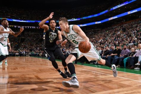 Celtics forward Jonas Jerebko drives against Bucks rookie Rashad Vaughn.