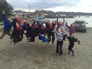 The new spring Novice team jumping in joy of the new season. From left to right: Patrick Houle, Leah Humphrey, Eleanor Smith, Rosie Iaria, Bridget McGonagael, Kayla Collins, Grace Gruber, Chloe Brusard, Lucy Nash, Perrin O’cone, Hanna Hopkins, Molly Maravel, Gianna Merian, Sophia Franklin, Margaret McDowell, Caitlin Comer, Kate Stupin, and Jessica Carr.