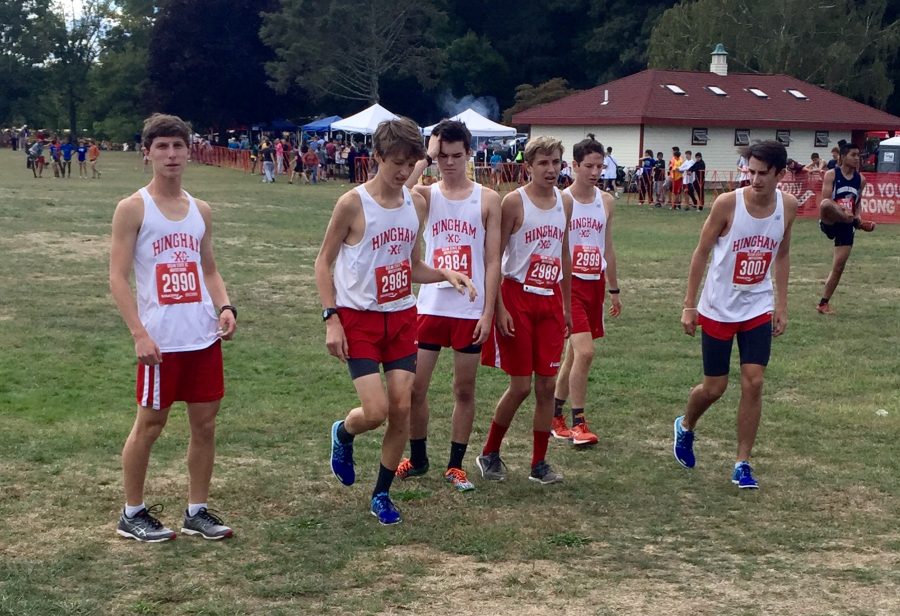  Left to right: Juniors Michael Hill, Tim Dwyer, Ethan Drinkwater, Spencer Havens, and Sophomore Jack Myers along with Senior Jack Papich warming up on the starting line of their race.