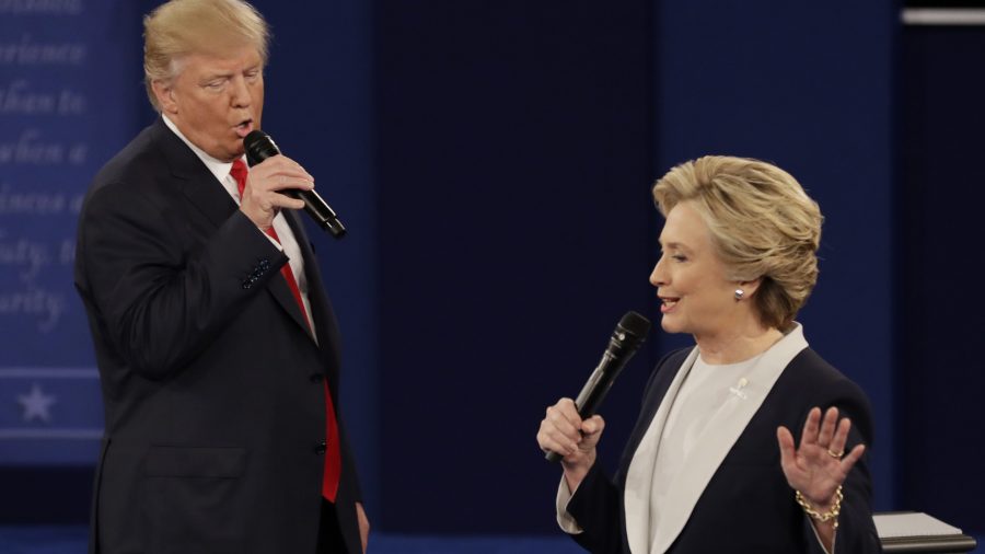 Trump interrupts Clinton as she attempts to speak during the second debate.