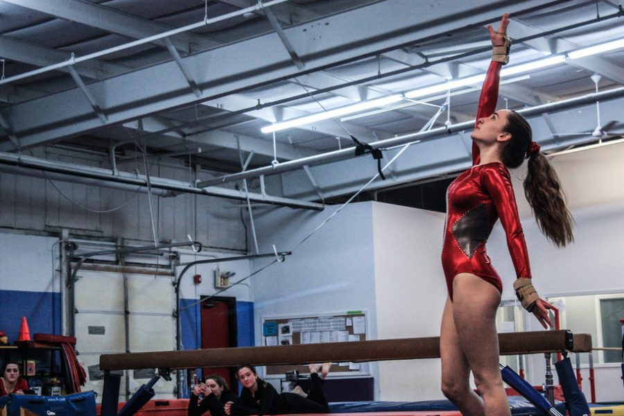 Freshman Sophie Spielberger poses at the end of her floor routine