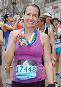 Mrs. Knoblock proudly smiling after finishing the marathon.