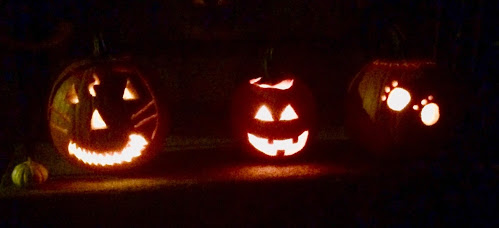 Pumpkins the author carved with her family this past Thursday to celebrate the season.