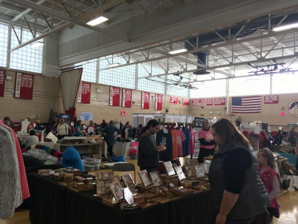 The high schools gymnasium filled with various local businesses stands.
