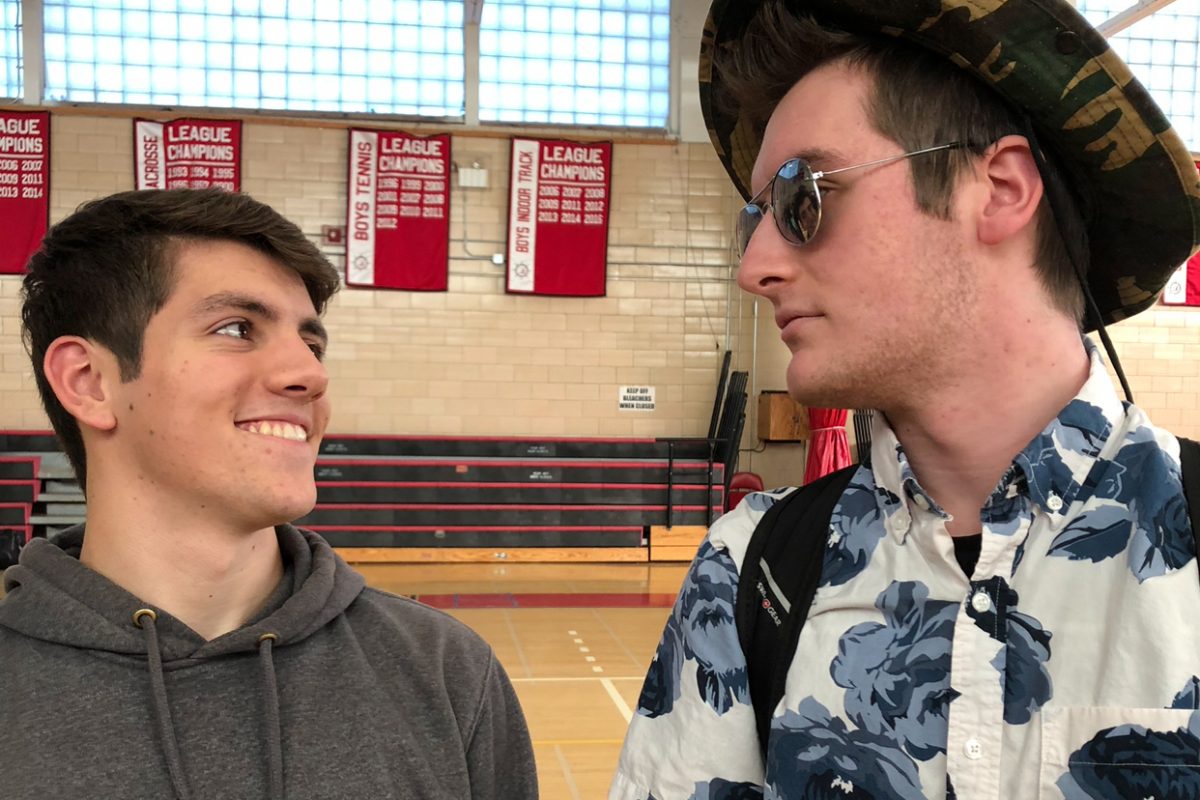 Senior+Andre+Lavoie+%28left%29%2C+boldly+embracing+Hawaiian+Day%2C+quietly+judges+Senior+Jeremy+Canney+%28right%29%2C+who+wore+a+simple+sweatshirt+and+khakis+to+school.
