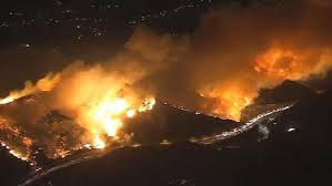The Skirball Fire burns in the Bel Air, threatening multiple homes and buildings. 
Photo via NBC Los Angeles.