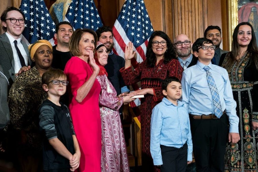 Nancy Pelosi swears in Rashida Tlaib on Jan. 3 (Doug Mills / New York Times)