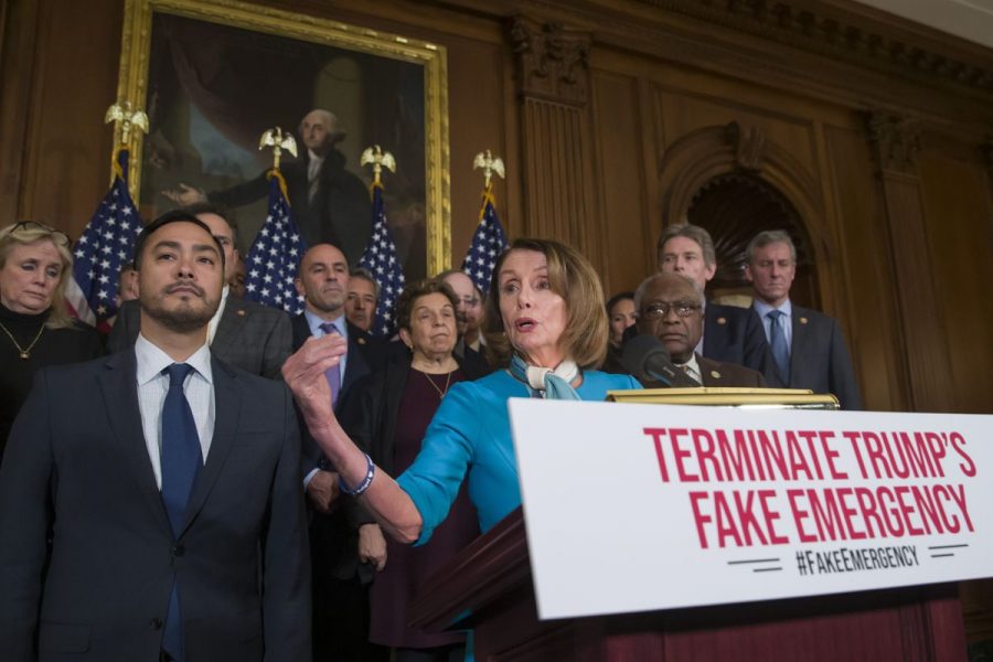 House Speaker Nancy Pelosi of California, alongside Rep. Joaquin Castro of Texas, left, as well as others, speaks about a resolution to block Trumps national emergency declaration.