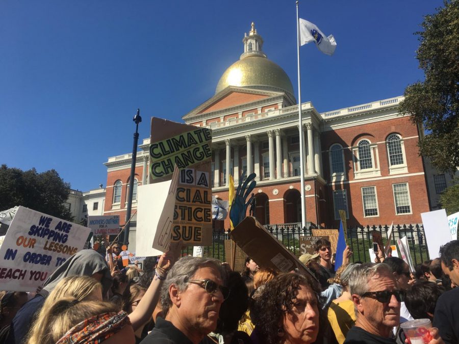 Protestors+pass+the+Massachusetts+State+House.