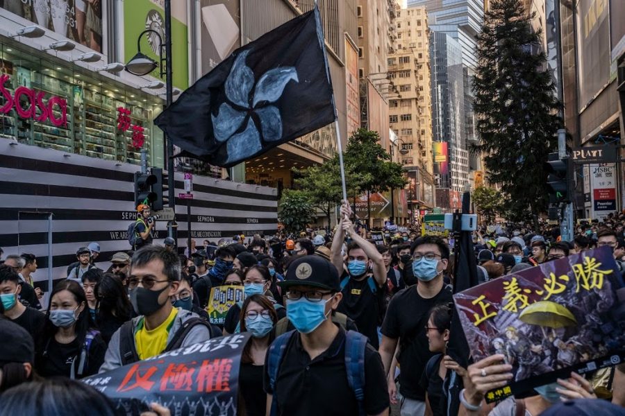 Protesters+march+peacefully+through+the+Causeway+Bay+district+of+Hong+Kong.