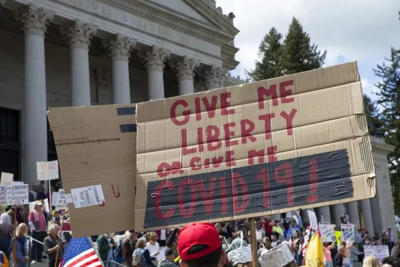 In Olympia, Washington, hundreds of protesters crowded the Capitol building on April 19th, carrying signs with aggressive messages and violating social distancing guidelines.