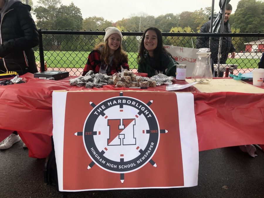 Meryl Goodwin and Lizzie Quinlivan at the rainy Homecoming table. 