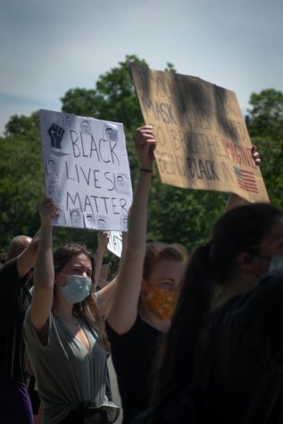 The pictures of victims were displayed on poster board and held up by various protesters.