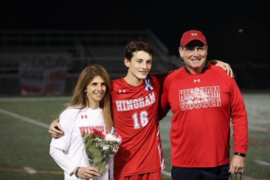 First, Senior Brendan Costello takes the center field with mother and father.