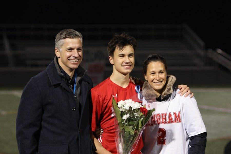 Senior Josh Dargis follows with mother and father.