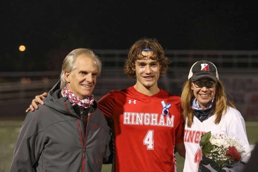 Senior Paul Forbes with mother and father.