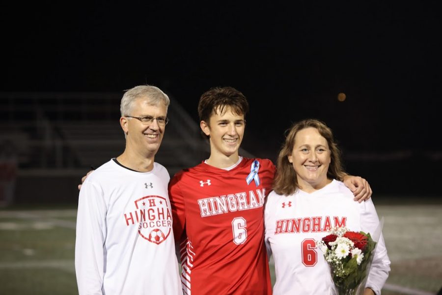Senior William Fetsko with mother and father.