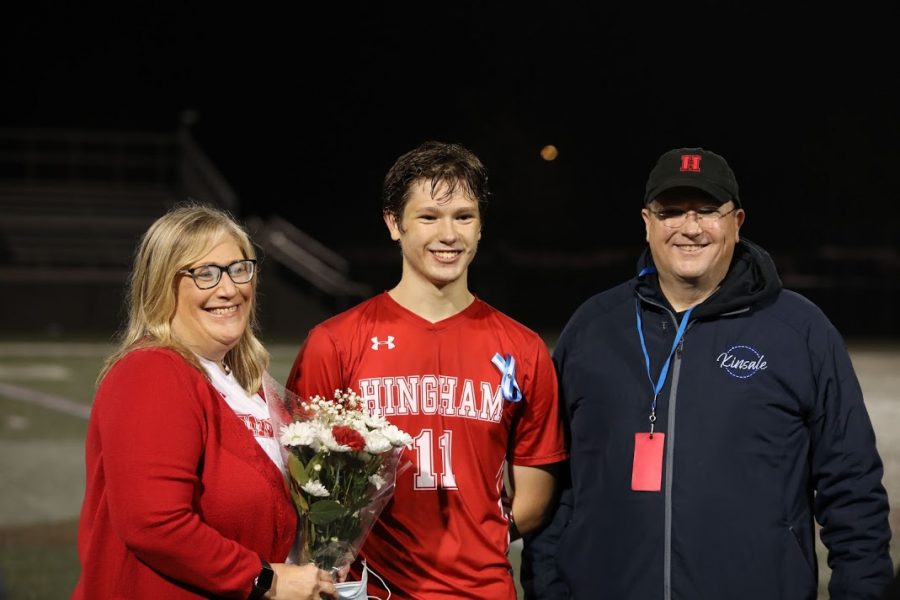 Senior Brendan Power with mother and father.
