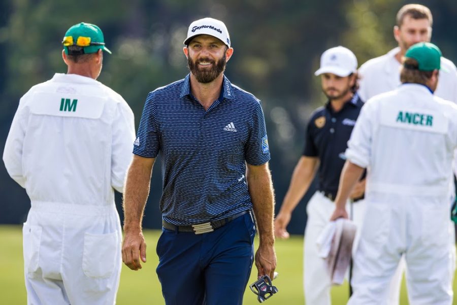 Dustin Johnson walks off of the 14th green after making a birdie putt.