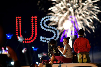 Children watch fireworks to celebrate Bidens victory.