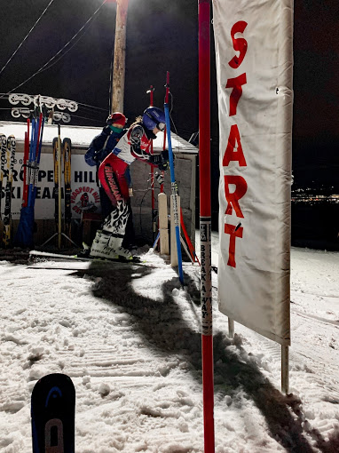 Hingham Captain, Jaycee Waal, getting ready to push out of the start in one of her last high school races where she goes on to win the race.