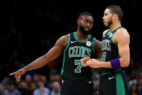 Jaylen Brown and Jayson Tatum of the Celtics talk during a game against the Houston Rockets.