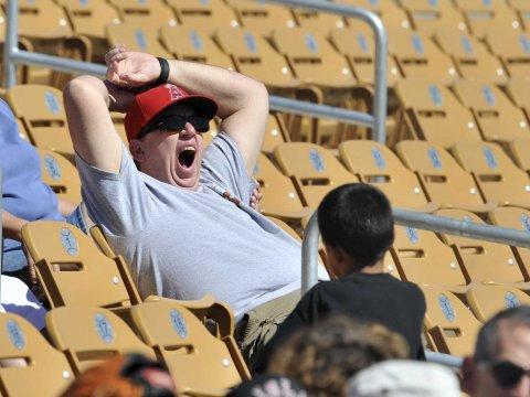 Here is a look at a fan yawning while in attendance of 3 hour and 28-minute long game that featured a 1-0 win by the Tampa Bay Rays over the New York Yankees. 