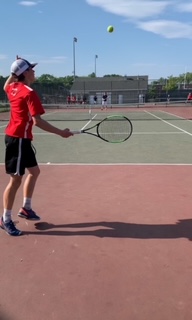 Sophomore, Thomas Fabrizio, holding his finger up to indicate his opponents shot was out. 