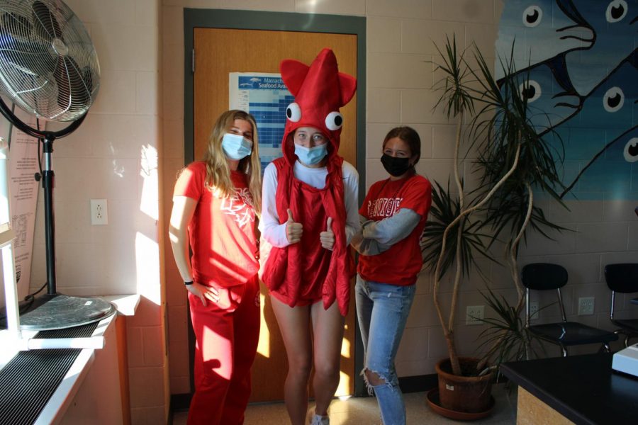 Seniors Dee O'Donnell, Ellie Fabbro, and Jade Weggeman wear read for Red Out Day