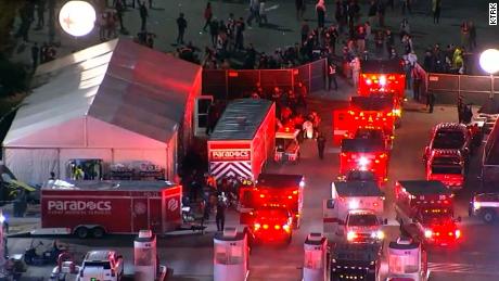 Ambulances rush to the scene to care for the victims of the tragedy at the 2021 Astroworld Festival in Houston.