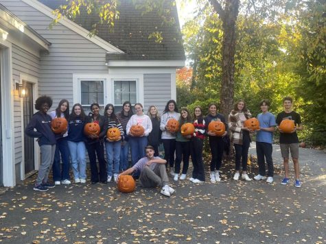 French exchange students and their Hingham hosts pose with their jack-o-lanterns.
