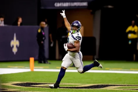 Seattle Seahawks rookie running back Kenneth Walker III celebrating his first carer touchdown run against the New Orleans Saints. 