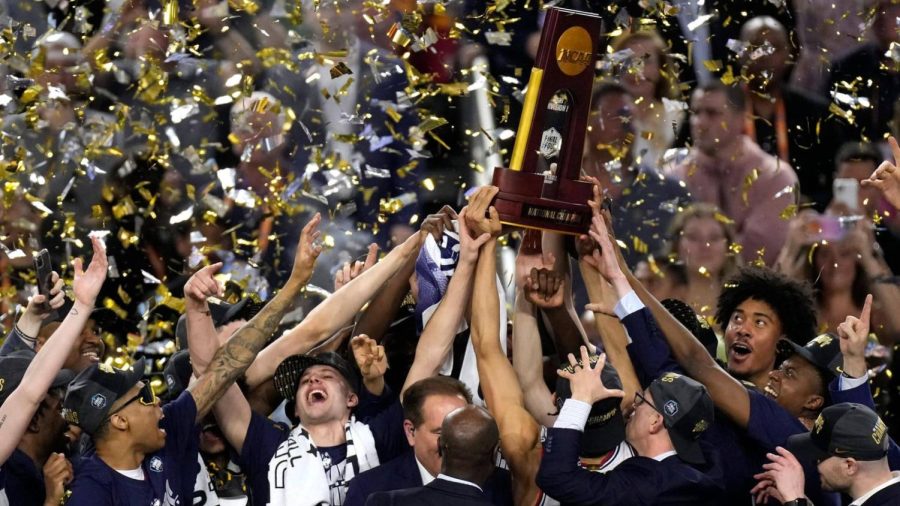 UConn+raises+their+trophy+after+their+win.%0A13+News+Now+at+ABC
