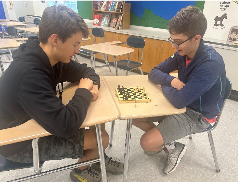 Sophomore+Luke+Desantis+playing+freshman+Noel+Eigenmann+on+a+mini+chess+board