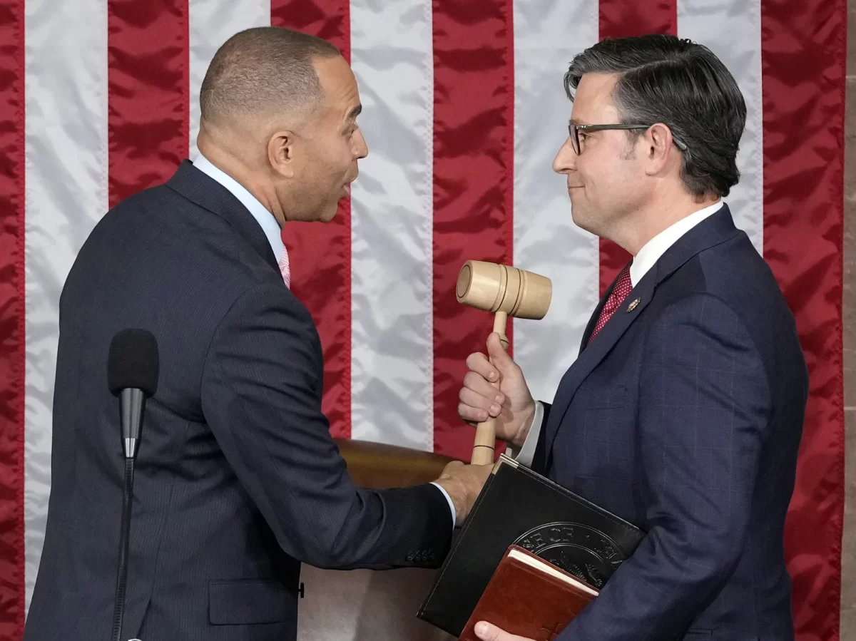 Mike Johnson accepts the Speaker gavel from Hakeem Jeffries of New York 
Alex Brandon/NPR