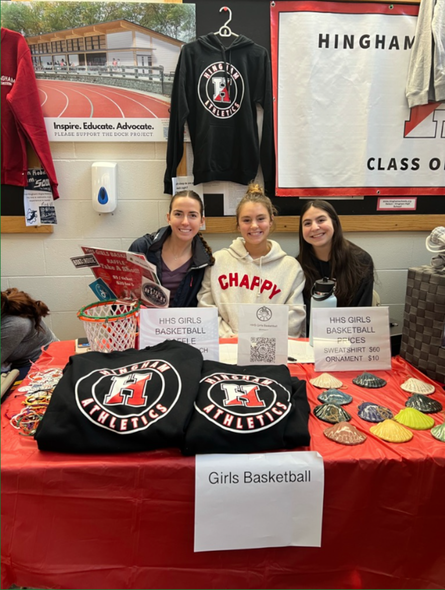 Captains Marisa Matthews, Sophie Kerr, and Nina Crean sell goods for girls basketball.