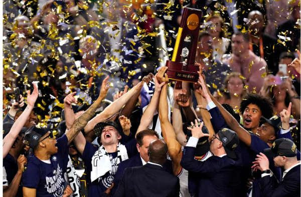 Connecticut players celebrate after beating SDSU in the national championship on April 3rd 2023 (Godofredo A. Vasquez/AP)