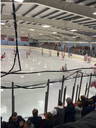 The varsity boys hockey team compete in a home game.