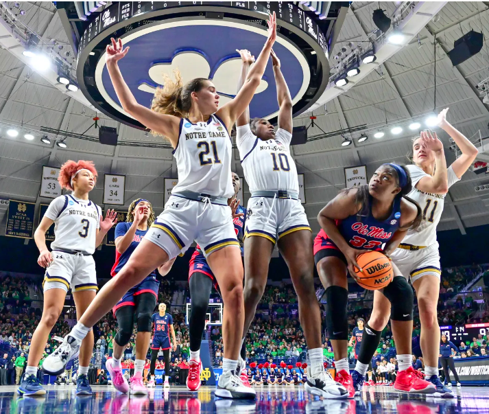 Notre Dames Becky Obinma (10), Maddy Westbeld (21), and Sonia Citron (11) defend Ole Miss Kharyssa Richardson (33) in the second round of the 2024 tournament. (Credit: Matt Cashore, USA TODAY Sports)