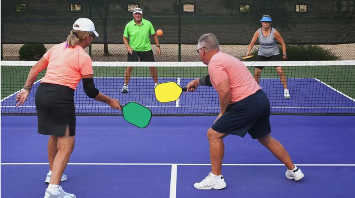 Two couples enjoying a game of doubles pickleball (Forbes)
