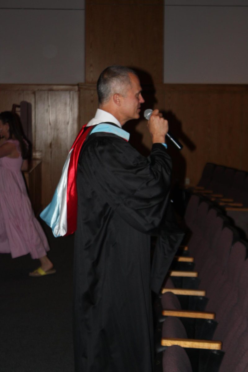 Principal, Rick Swanson, speaking to the graduating class prior to the ceremony. Credit: Joshua Ross